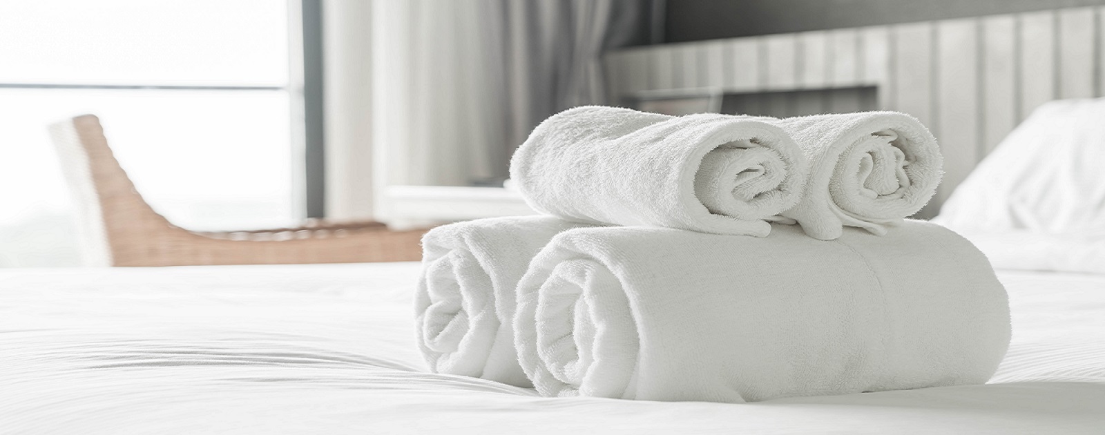 White towel on bed decoration in bedroom interior